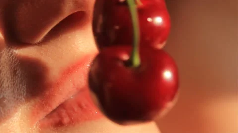 Red cherry eating Stock Footage 33249213