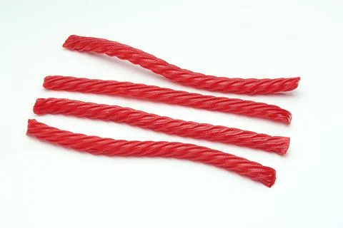 Red Cherry Flavored Licorice assorted candy group pile on white background Stock Photos