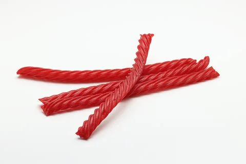 Red Cherry Flavored Licorice assorted candy group pile on white background Stock Photos