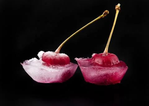 Red cherry is in ice Stock Photos