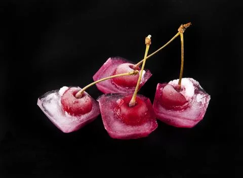 Red cherry is in ice Stock Photos