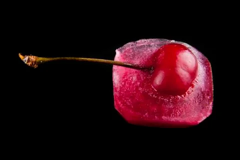 Red cherry is in ice Stock Photos