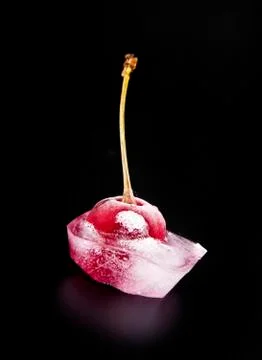 Red cherry is in ice Stock Photos