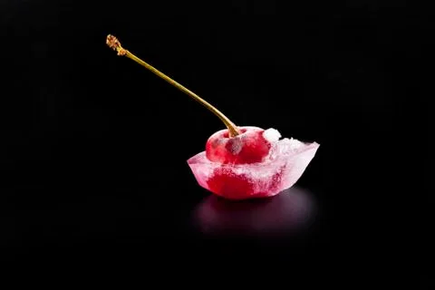 Red cherry is in ice Stock Photos