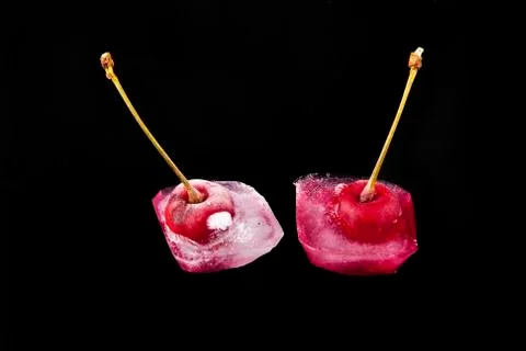 Red cherry is in ice Stock Photos