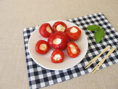 Red cherry pepper stuffed with fresh cheese Stock-Fotos