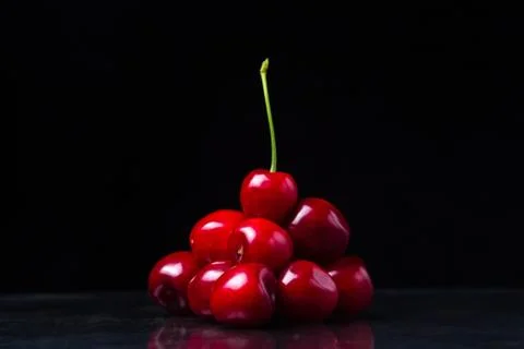 Red cherry pyramid. Red cherries folded in the form of a pyramid.  Stock Photos