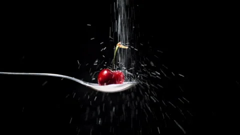 Red cherry with stalk drops sugar in slow motion Stock Footage 131406334