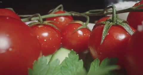 Red cherry tomato brunch with water drops, macro shot Stock Footage 330122611