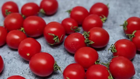 Red Cherry Tomatoes On A Blue Marble Background. Panning Dolly Slider Shot. Clos Vídeos de archivo 150900128