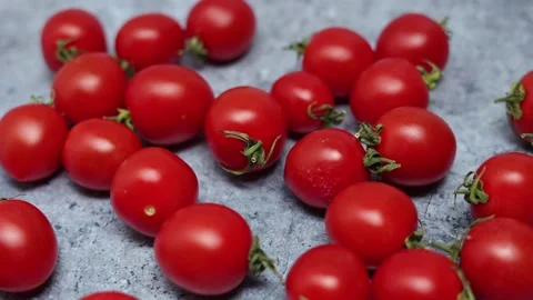 Red Cherry Tomatoes On A Blue Marble Background. Panning Dolly Slider Shot. Vídeos de archivo 150900375
