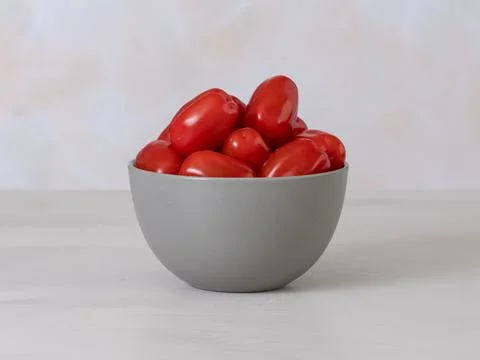 Red cherry tomatoes in a bowl, source Vitamins A and C are antioxidants, fr.. Stock Photos