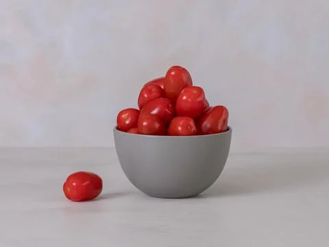 Red cherry tomatoes in a bowl, source of Vitamins A and C are antioxidants,.. Stock Photos