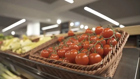Red cherry tomatoes packed in a basket for sale in the store Slog Stock Footage 127364019