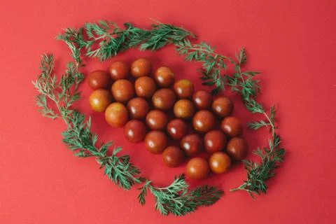 Red cherry tomatoes on red background Stock Photos