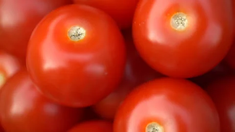 Red cherry tomatoes rotating on a plate. Stock Footage 91706873