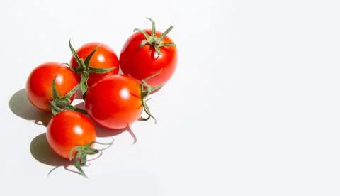 Red cherry tomatoes on a white background, arranged in a group.copyspace for Stock Photos