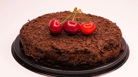 Red cherry topping on chocolate cake Stock Footage 101583722