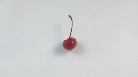 A Red Cherry on A White Background Stock Footage 301024704