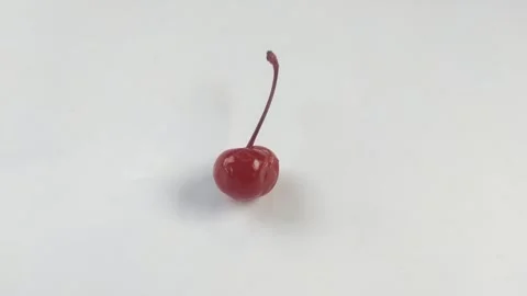 A Red Cherry on A White Background Stock Footage 301024707