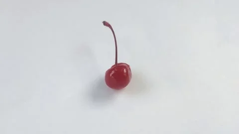 A Red Cherry on A White Background Stock Footage 301024708