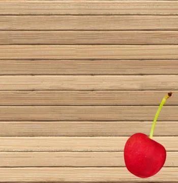 Red cherry on a wooden background Фото