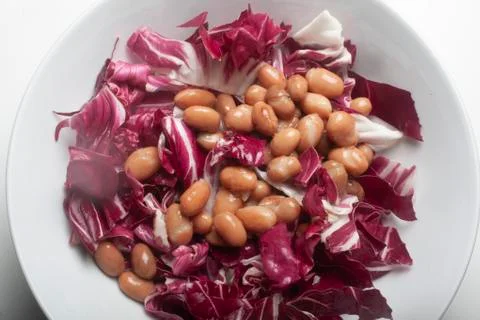 Red chicory with  beans Stock Photos