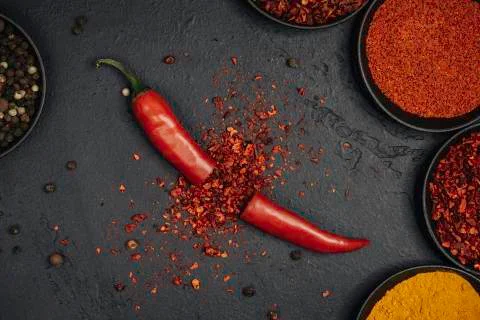 Red chili exploded into small pieces. Stock Photos