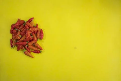 Red chili pattern on a yellow background. Top view. On flat lay. Chili Wallpa Stock Photos