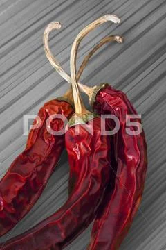 Red chili pepper and spaghetti Stock Photos