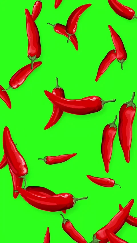 Red Chili Peppers Falling Downward on a Bright Green Background Stock Footage 343830898