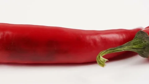 Red chili peppers. Side view. Loop motion. Stock Footage 163740160