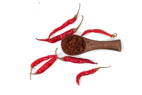 Red chilli and chilli powder in wooden spoon isolated on white background. 스톡 사진