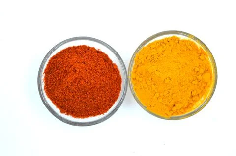 Red chilli and turmeric powder on bowl Stock Photos