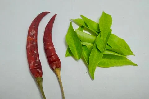 Red chilli, curry leaf On A White Background Stock Stock Photos