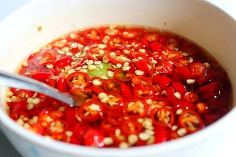 Red chilli in fish sauce Thai seasoning. Stock Photos