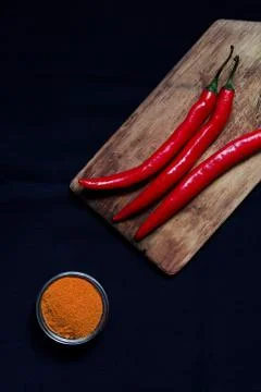 Red chilli pepper background dark blue tablecloth Stock Photos