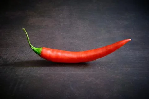 Red chilli pepper on dark background Stock Photos