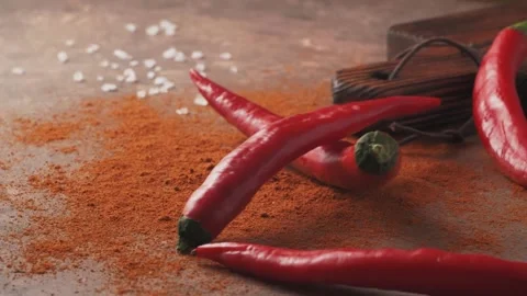 Red chilli peppers Falling down in Exotic Spices. Slow Motion Stock Footage 147861385