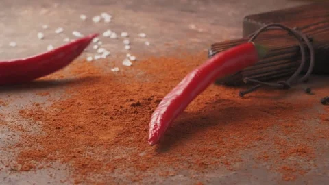 Red chilli peppers Falling down in Exotic Spices. Slow Motion Stock Footage 147861394