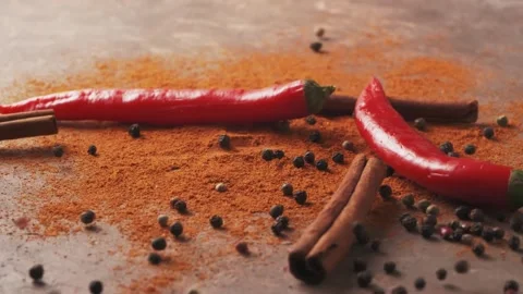 Red chilli peppers Falling down in Exotic Spices. Slow Motion Stock Footage 147861415