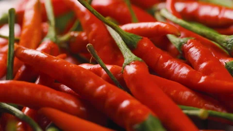 Red chilli rotating around on a bowl. Spicy flavor for spice food menu. Video stock 151653030