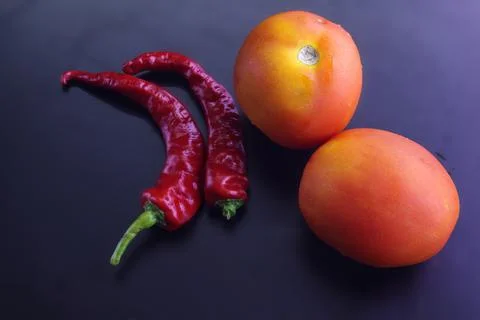 Red chilly with tomatoes Foto stock