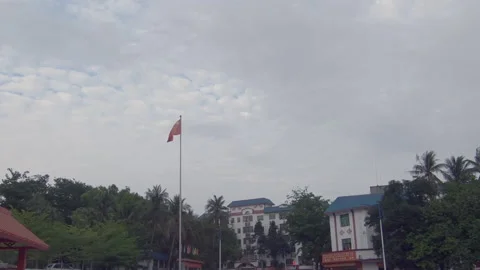 Red Chinese flag at a school in a small town in Yunnan 스톡 동영상 235737834