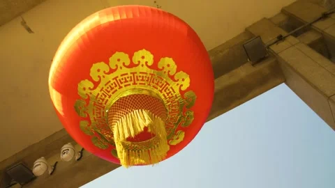Red Chinese Lantern Hanging Beneath Stone Structure at Summer Palace, Beijing Stock Footage 345687959