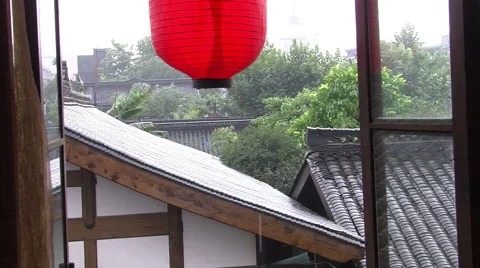 Red Chinese lantern, rooftops, rain, China Stock Footage 54770496