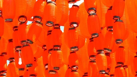 Red Chinese lantern with sky background on sunny day. The lantern is decorate Stock Footage 96321885