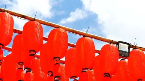 Red Chinese lantern with sky background on sunny day. The lantern is decorate Stock Footage 96322110
