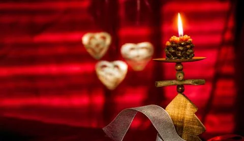 Red Christmas background with candle Stock Photos