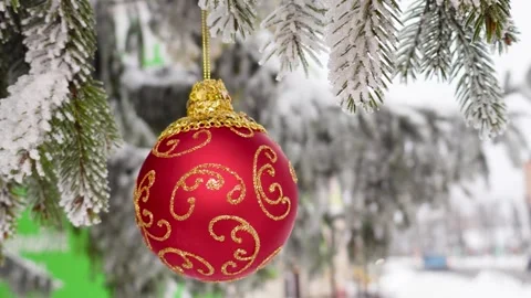 Red Christmas ball with patterns on a semi-blurred background Stock Footage 258645334